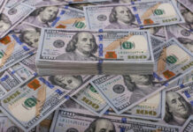 Overhaul Bleeding Billions But More Needed Stack of one hundred dollar bills, Benjamin Franklins portrait.