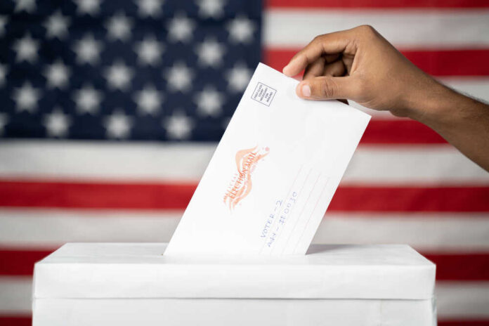 Maski,,India,14,September,,2020,:,Concept,Of,Mail,In Hand inserting mail-in ballot envelope into ballot box