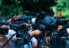 Trump’s Name On Mailbox Brings Massive Bump TV news cameras crowding together at an outdoor event