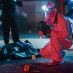 Teen Ghost Gun Chaos Under Space Needle Forensic investigator examines crime scene at night.