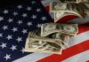 Labor Day SHOCK: $4+ Everywhere Dollar bills arranged on an American flag