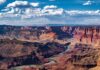 Canyon Horror: Human Remains Surface A panoramic view of the Grand Canyon with a river winding through the landscape
