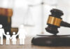 VIDEO: Mom Branded Abuser For WHAT?! Gavel with family symbols and legal book background.