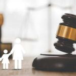 VIDEO: Mom Branded Abuser For WHAT?! Gavel with family symbols and legal book background.