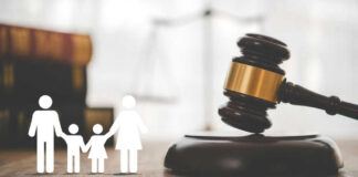 Gavel with family symbols and legal book background.