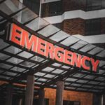 Dorm Chaos: Five Hit Before Dawn Illuminated emergency sign at a hospital entrance
