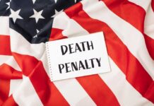 Death Penalty For THIS Notorious Killer!? Notebook with message on an American flag background