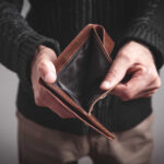 Wallets Bleed: Debt Shock Hits Millions Person holding an open empty wallet
