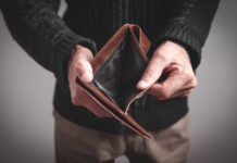 Wallets Bleed: Debt Shock Hits Millions Person holding an open empty wallet