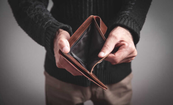 Man,Holding,Empty,Wallet.,No,Money Person holding an open empty wallet