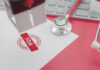 FDA warning stamp near stethoscope and keyboard