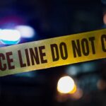 Crime Horror, Judge’s Call Questioned Police tape with blurred emergency lights in the background