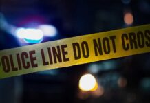 Crime Horror, Judge’s Call Questioned Police tape with blurred emergency lights in the background
