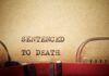 Execution Of Killer Fails Typewriter typing the phrase 'Sentenced to Death' on aged paper