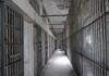 Botched Execution Shocker Empty prison corridor with barred cells on either side