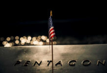 HUGE: Pentagon Doubles Down American flag above engraved Pentagon sign at night