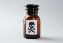 Tainted Baby Tea Sparks Urgent Recall Brown glass bottle with skull and crossbones label