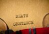 Execution Spree Continues Tonight Typewriter typing the words death sentence on paper