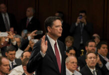 Comey Faces TROUBLE James Comey raises his right hand during a formal hearing; Jared Coreau not visible